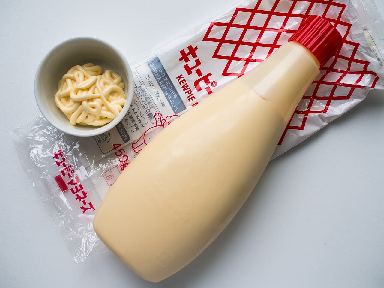 A bottle of Kewpie Mayonnaise -- the standard recipe is built on egg yolk, though Kewpie also makes an official vegan version